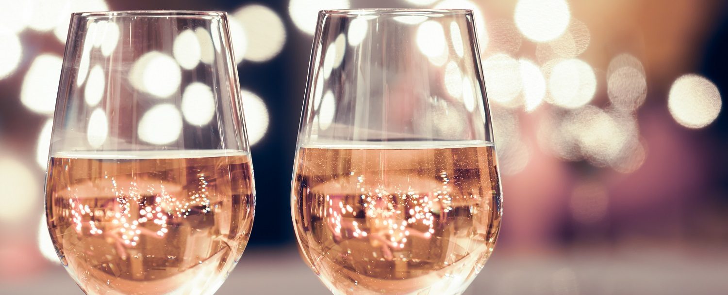 two glasses of rose wine with blurred background